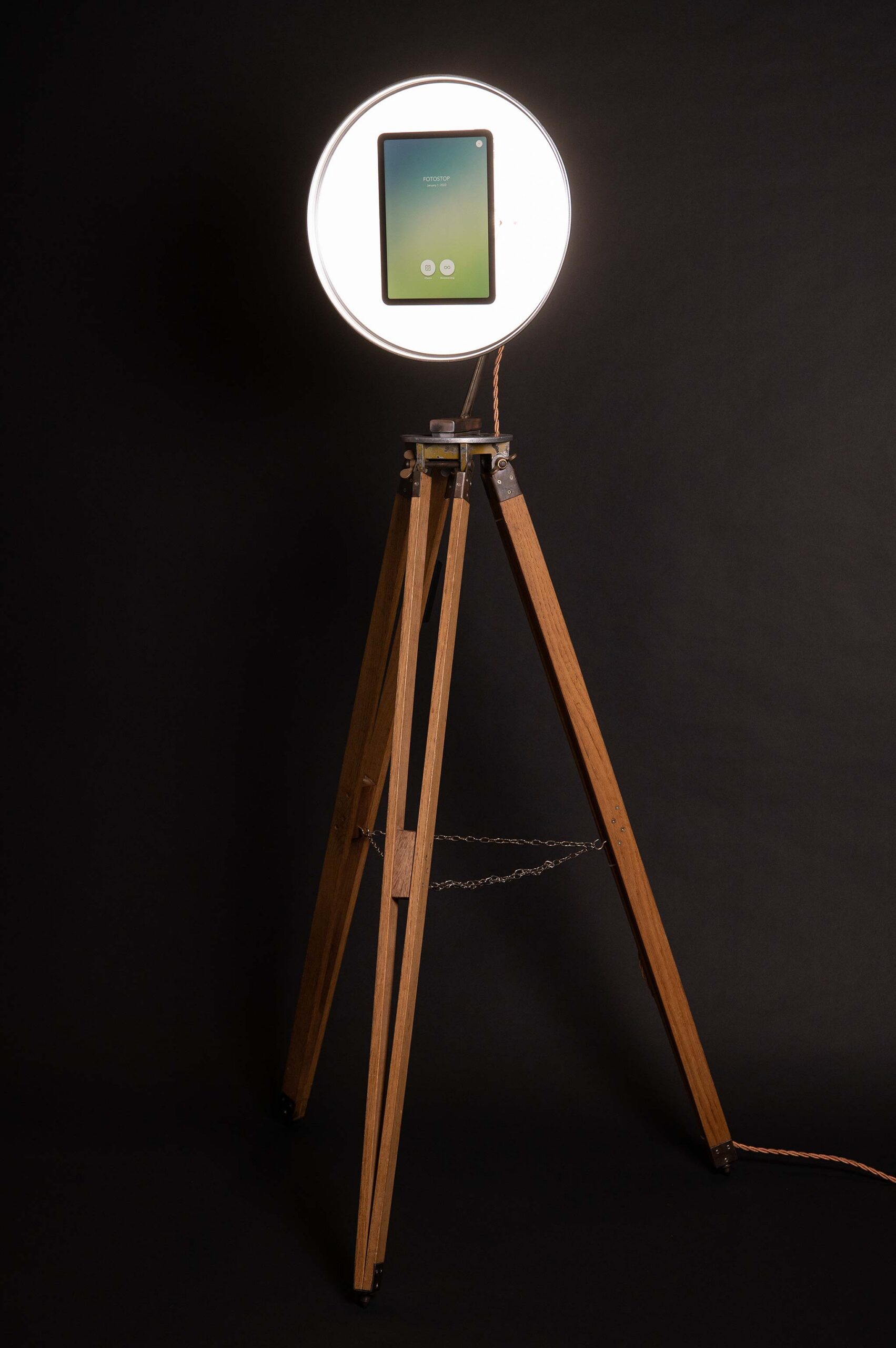 FotoStop portable mini photo booth on a tripod