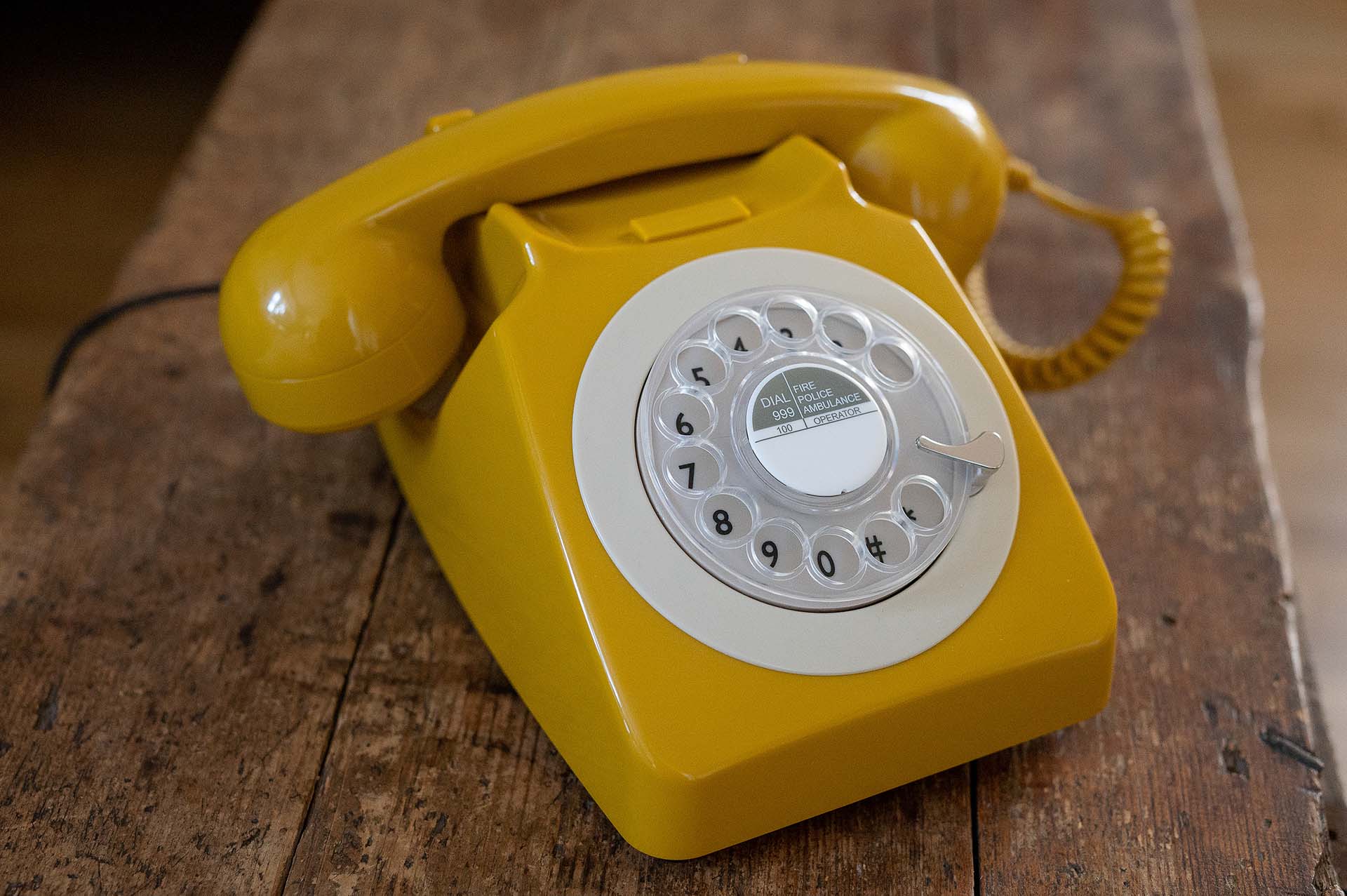 Yellow rotary phone used as an audio guest book for recorded messages